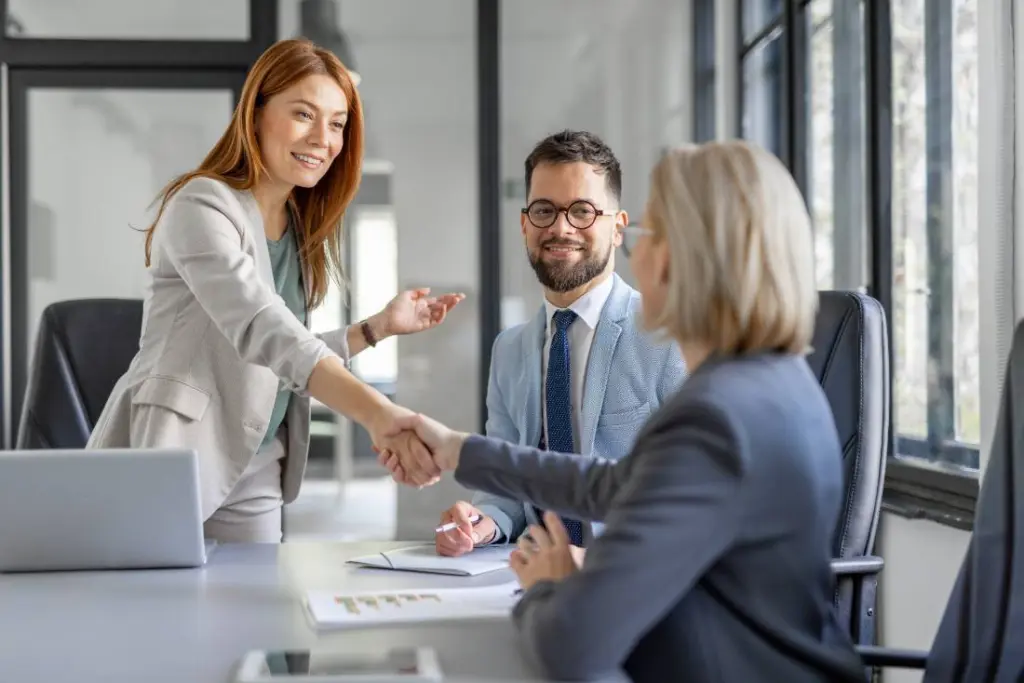 A handshake between an accountant and client