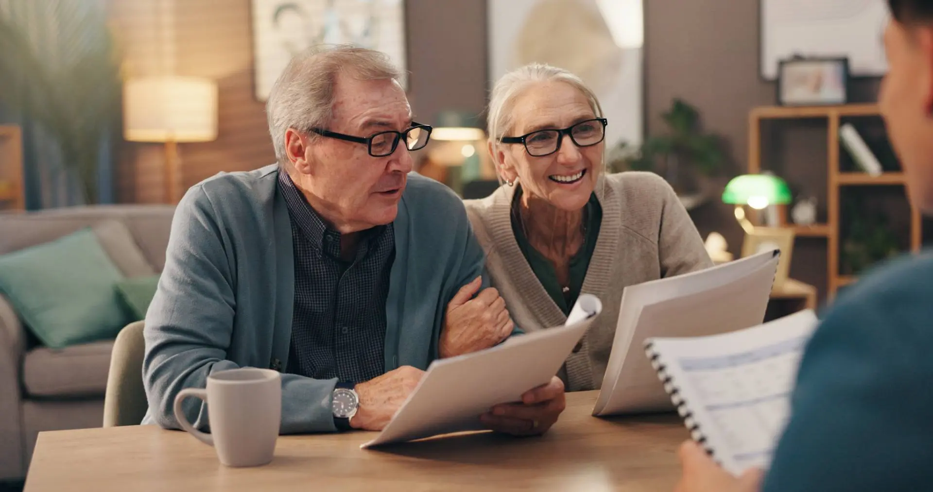 Clients reviewing prepared financial statements with an accountant