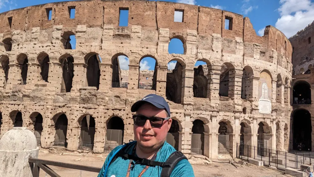 Shawn Charest in front of the Colosseum in Rome